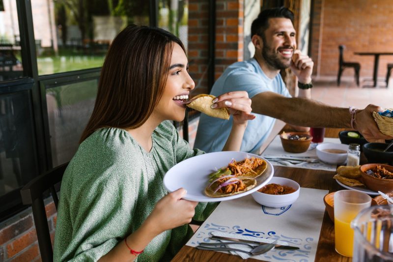 woman eating a taco at Amelia Island restaurant