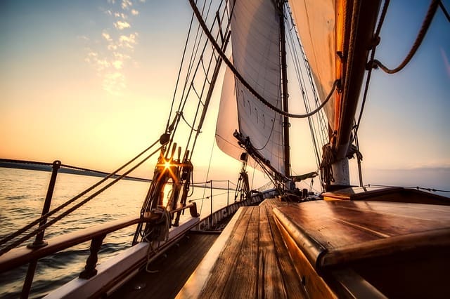 sailing on the ocean at sunset